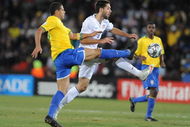 JOHANNESBURG, SOUTH AFRICA - JUNE 28: Felipe Melo of Brazil and Clint Dempsey of USA compete during the 2009 Confederations Cup final match between Brazil and USA from Ellis Park on June 28, 2009 in Johannesburg, South Africa. (Photo by Lefty Shivambu/Gallo Images/Getty Images)