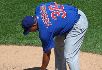CHICAGO - JUNE 28: Carlos Zambrano #38 of the Chicago Cubs wipes off the pitching rubber with his glove during a game against the Chicago White Sox on June 28, 2009 at U.S. Cellular Field in Chicago, Illinois. The White Sox defeated the Cubs 6-0. (Photo by Jonathan Daniel/Getty Images)