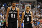 DALLAS - APRIL 25:  Forward Tim Duncan #21 and Tony Parker #9 of the San Antonio Spurs during a 99-90 loss against the Dallas Mavericks in Game Four of the Western Conference Quarterfinals during the 2009 NBA Playoffs at American Airlines Center on April 25, 2009 in Dallas, Texas. NOTE TO USER: User expressly acknowledges and agrees that, by downloading and or using this photograph, User is consenting to the terms and conditions of the Getty Images License Agreement.  (Photo by Ronald Martinez/Getty Images)
