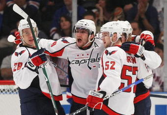 NEW YORK - APRIL 26: (L-R) Alexaner Semin #28,  Alex Ovechkin #8, Nicklas Backstrom #19 and Mike Green #52 of the Washington Capitals celebrate their goal at 16:44 of the second period against the New York Rangers during Game Six of the Eastern Conference Quarterfinal Round of the 2009 NHL Stanley Cup Playoffs at Madison Square Garden on April 26, 2009 in New York, New York. (Photo by Bruce Bennett/Getty Images)