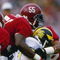 Linebacker Derrick Thomas of the Alabama Crimson Tide makes a tackle during a game against the Michigan Wolverines at Byrant Denny Stadium in Tuscawosa, Alabama.