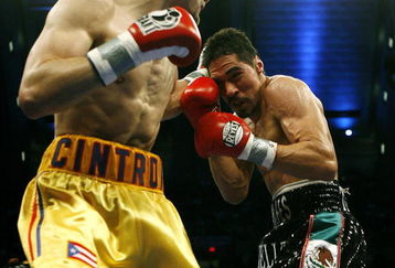 ATLANTIC CITY, NJ  - APRIL 12: Kermit Cintron (L) throws a punch during his IBF World Welterweight Title bout against Antonio Margarito at Boardwalk Hall on April 12, 2008 in Atlantic City, New Jersey. (Photo by Jeff Zelevansky/Getty Images)   