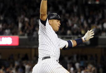 NEW YORK - AUGUST 07:  Alex Rodriguez #13 of the New York Yankees celebrates a walk off home run against the Boston Red Sox in the 15th inning on August 7, 2009 at Yankee Stadium in the Bronx borough of New York City.  The New York Yankees defeated the Boston Red Sox 2-0.  (Photo by Jeff Zelevansky/Getty Images)