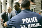 RICHMOND, VA - JULY 26:   Atlanta Falcons quarterback Michael Vick (C) leaves the federal courthouse following his arraignment on July 26, 2007 in Richmond, Virginia. Vick pleaded not guilty Thursday to federal dogfighting charges and was released without bond until a November 26 trial.  (Photo by Haraz N. Ghanbari-Pool/Getty Images)