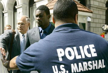 RICHMOND, VA - JULY 26:   Atlanta Falcons quarterback Michael Vick (C) leaves the federal courthouse following his arraignment on July 26, 2007 in Richmond, Virginia. Vick pleaded not guilty Thursday to federal dogfighting charges and was released without bond until a November 26 trial.  (Photo by Haraz N. Ghanbari-Pool/Getty Images)