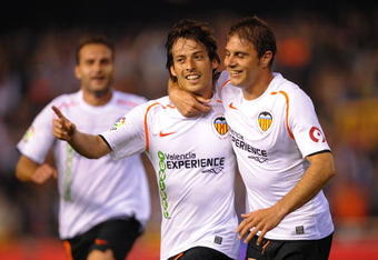 VALENCIA, SPAIN - MAY 09: David Silva (L) of Valencia celerbrates with Joaquin Sanchez  after scoring his team's second goal during the La Liga match between Valencia and Real Madrid at the Mestalla stadium on May 9, 2009 in Valencia, Spain.  (Photo by Denis Doyle/Getty Images)