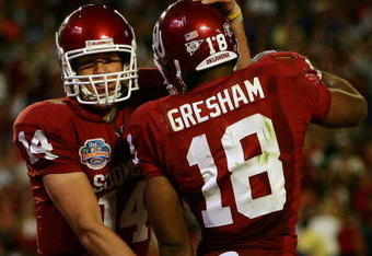 MIAMI - JANUARY 08:  Sam Bradford #14 of the Oklahoma Sooners celebrates with teammates Jermaine Gresham #18 after scoring a touchdown againist the Florida Gators during the FedEx BCS National Championship Game at Dolphin Stadium on January 8, 2009 in Miami, Florida.  (Photo by Donald Miralle/Getty Images)