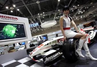 GOYANG, SOUTH KOREA - APRIL 5: A Model poses next to a Honda F1 racing car at the Seoul Motor Show 2007 on April 5, 2007 in Goyang, South Korea. The Seoul Motor Show 2007 will be held in April 6-15, featuring state-of-the-art technologies and concept cars from global automakers. The show is its sixth since the first one was held in 1995. About 186 companies from 10 countries, including auto parts manufacturers and tire makers, will set up booths to showcase trends in their respective industries, and to promote their latest products during the show. (Photo by Chung Sung-Jun/Getty Images)