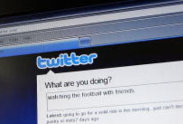 NEWCASTLE, AUSTRALIA - JULY 11:  In this photo illustration the Twitter website is displayed on a mobile phone at a NRL match on July 11, 2009 in Newcastle, Australia. The micro-blogging phenomenon sees users post text 'tweets' of upto 140 characters in response to the question 'What are you doing?'.  (Photo by Cameron Spencer/Getty Images)