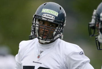 RENTON, WA - MAY 02:  Linebacker Aaron Curry #59 of the Seattle Seahawks talks with teammates during minicamp at the Seahawks' training facility on May 2, 2009 in Renton, Washington. (Photo by Otto Greule Jr/Getty Images)