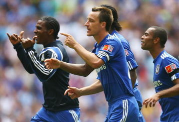 LONDON, ENGLAND - AUGUST 09:  Florent Malouda, John Terry and Ashley Cole of Chelsea celebrate victory in the penalty shoot out during the FA Community Shield match between Manchester United and Chelsea at Wembley Stadium on August 9, 2009 in London, England.  (Photo by Paul Gilham/Getty Images)