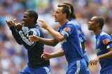 LONDON, ENGLAND - AUGUST 09:  Florent Malouda, John Terry and Ashley Cole of Chelsea celebrate victory in the penalty shoot out during the FA Community Shield match between Manchester United and Chelsea at Wembley Stadium on August 9, 2009 in London, England.  (Photo by Paul Gilham/Getty Images)