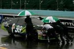 WATKINS GLEN, NY - AUGUST 09:  Crew members push the #99 Aflac Ford, driven by Carl Edwards, off the grid after a rain delay in the NASCAR Sprint Cup Series Heluva Good! Sour Cream Dips at Watkins Glen International on August 9, 2009 in Watkins Glen, New York.  (Photo by Todd Warshaw/Getty Images for NASCAR)