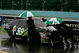 WATKINS GLEN, NY - AUGUST 09: Crew members push the #99 Aflac Ford, driven by Carl Edwards, off the grid after a rain delay in the NASCAR Sprint Cup Series Heluva Good! Sour Cream Dips at Watkins Glen International on August 9, 2009 in Watkins Glen, New York. (Photo by Todd Warshaw/Getty Images for NASCAR)