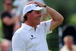 AKRON, OH - AUGUST 07:  Phil Mickelson of USA reacts to his putt on the 17th hole during the second round of the World Golf Championship Bridgestone Invitational on August 7, 2009 at Firestone Country Club in Akron, Ohio.  (Photo by Stuart Franklin/Getty Images)