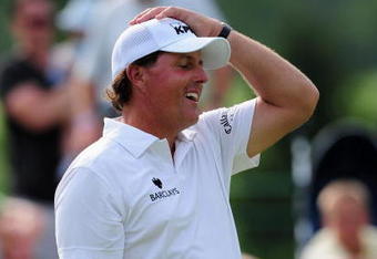 AKRON, OH - AUGUST 07:  Phil Mickelson of USA reacts to his putt on the 17th hole during the second round of the World Golf Championship Bridgestone Invitational on August 7, 2009 at Firestone Country Club in Akron, Ohio.  (Photo by Stuart Franklin/Getty Images)