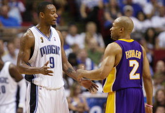 ORLANDO, FL - JUNE 11:  Rashard Lewis #9 of the Orlando Magic talks with Derek Fisher #2 of the Los Angeles Lakers in Game Four of the 2009 NBA Finals at Amway Arena on June 11, 2009 in Orlando, Florida.  The Lakers won 99-91 in overtime and lead the series 3-1.  NOTE TO USER: User expressly acknowledges and agrees that, by downloading and or using this photograph, User is consenting to the terms and conditions of the Getty Images License Agreement. (Photo by Elsa/Getty Images)
