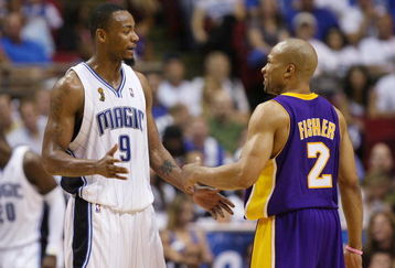 ORLANDO, FL - JUNE 11:  Rashard Lewis #9 of the Orlando Magic talks with Derek Fisher #2 of the Los Angeles Lakers in Game Four of the 2009 NBA Finals at Amway Arena on June 11, 2009 in Orlando, Florida.  The Lakers won 99-91 in overtime and lead the series 3-1.  NOTE TO USER: User expressly acknowledges and agrees that, by downloading and or using this photograph, User is consenting to the terms and conditions of the Getty Images License Agreement. (Photo by Elsa/Getty Images)