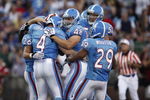 CANTON, OH - AUGUST 9: A.J. Trapasso #4 of the Tennessee Titans celebrates with teammates after running for a touchdown on a fake punt against the Buffalo Bills during the Pro Football Hall of Fame Game at Fawcett Stadium on August 9, 2009 in Canton, Ohio. (Photo by Joe Robbins/Getty Images)