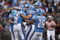 CANTON, OH - AUGUST 9: A.J. Trapasso #4 of the Tennessee Titans celebrates with teammates after running for a touchdown on a fake punt against the Buffalo Bills during the Pro Football Hall of Fame Game at Fawcett Stadium on August 9, 2009 in Canton, Ohio. (Photo by Joe Robbins/Getty Images)