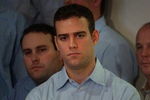 BOSTON - NOVEMBER 2:  Former Red Sox general manager Theo Epstein looks on November 2, 2005 as principal owner John Henry speaks with the media at Fenway Park in Boston, Massachusetts. Epstein resigned as general manager on October 31 nearly a year after the franchise won its first World Series championship since 1918.  (Photo by Darren McCollester/Getty Images)