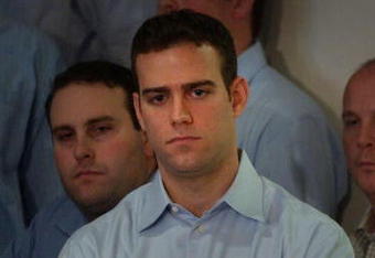 BOSTON - NOVEMBER 2:  Former Red Sox general manager Theo Epstein looks on November 2, 2005 as principal owner John Henry speaks with the media at Fenway Park in Boston, Massachusetts. Epstein resigned as general manager on October 31 nearly a year after the franchise won its first World Series championship since 1918.  (Photo by Darren McCollester/Getty Images)