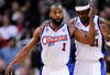 LOS ANGELES, CA - FEBRUARY 18:  Baron Davis #1 of the Los Angeles Clippers consoles Ricky Davis #31 during their , 142-119, loss to the Phoenix Suns at the Staples Center February 18, 2009, in Los Angeles, California. NOTE TO USER: User expressly acknowledges and agrees that, by downloading and or using this photograph, User is consenting to the terms and conditions of the Getty Images License Agreement.  (Photo by Kevork Djansezian/Getty Images)