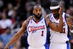 LOS ANGELES, CA - FEBRUARY 18:  Baron Davis #1 of the Los Angeles Clippers consoles Ricky Davis #31 during their , 142-119, loss to the Phoenix Suns at the Staples Center February 18, 2009, in Los Angeles, California. NOTE TO USER: User expressly acknowledges and agrees that, by downloading and or using this photograph, User is consenting to the terms and conditions of the Getty Images License Agreement.  (Photo by Kevork Djansezian/Getty Images)