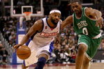 LOS ANGELES - FEBRUARY 25:  Baron Davis #1 of the Los Angeles Clippers drives around Leon Powe #0 of the Boston Celtics on February 25, 2009 at Staples Center in Los Angeles, California.  The Clippers won 93-91.   NOTE TO USER: User expressly acknowledges and agrees that, by downloading and/or using this Photograph, user is consenting to the terms and conditions of the Getty Images License Agreement. (Photo by Stephen Dunn/Getty Images)
