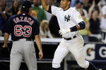 NEW YORK - AUGUST 07:  Alex Rodriguez #13 of the New York Yankees celebrates a walk off home run in the 15th inning as losing pitcher Junichi Tazawa #63 of the Boston Red Sox walks off the field on August 7, 2009 at Yankee Stadium in the Bronx borough of New York City.  The New York Yankees defeated the Boston Red Sox 2-0.  (Photo by Jeff Zelevansky/Getty Images)