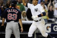 NEW YORK - AUGUST 07: Alex Rodriguez #13 of the New York Yankees celebrates a walk off home run in the 15th inning as losing pitcher Junichi Tazawa #63 of the Boston Red Sox walks off the field on August 7, 2009 at Yankee Stadium in the Bronx borough of New York City. The New York Yankees defeated the Boston Red Sox 2-0. (Photo by Jeff Zelevansky/Getty Images)