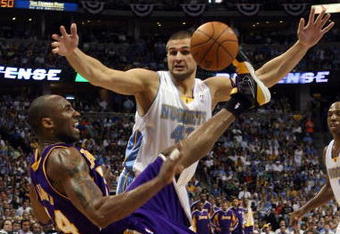 DENVER - MAY 29:  Kobe Bryant #24 of the Los Angeles Lakers falls down as the ball flies in the air in front of Linas Kleiza #43 of the Denver Nuggets in Game Six of the Western Conference Finals during the 2009 NBA Playoffs at Pepsi Center on May 29, 2009 in Denver, Colorado. NOTE TO USER: User expressly acknowledges and agrees that, by downloading and or using this photograph, User is consenting to the terms and conditions of the Getty Images License Agreement.  (Photo by Jed Jacobsohn/Getty Images)
