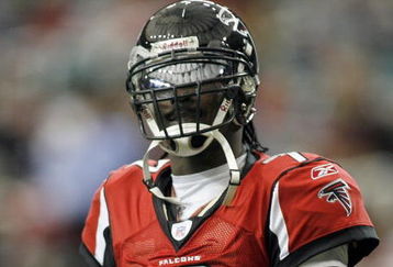 ATLANTA - DECEMBER 24: Quarterback Michael Vick #7 of the Atlanta Falcons looks on during the game against the Carolina Panthers on December 24, 2006 at The Georgia Dome in Atlanta,Georgia. (Photo by Marc Serota/Getty Images)