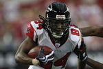 GLENDALE, AZ - JANUARY 03:  Wide receiver Roddy White #84 of the Atlanta Falcons runs with the ball past Dominique Rodgers-Cromartie #29 of the Arizona Cardinals during the NFC Wild Card Game on January 3, 2009 at University of Phoenix Stadium in Glendale, Arizona. The Cardinals defeated the Falcons 30-24.  (Photo by Jed Jacobsohn/Getty Images)