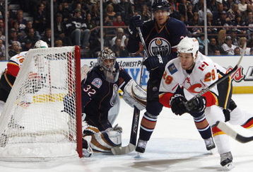 EDMONTON, CANADA - October 18: Goaltender Mathieu Garon #32 and Steve Staios #24 of the Edmonton Oilers defend against Brandon Prust #29 of the Calgary Flames during their NHL game on October 18, 2008 at Rexall Place in Edmonton, Alberta, Canada. (Photo by Dale MacMillan/Getty Images)