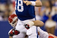INDIANAPOLIS - NOVEMBER 18: Peyton Manning #18 of the Indianapolis Colts looks to avoid being sacked by Jared Allen #69 of the Kansas City Chiefs on November 18, 2007 at the RCA Dome in Indianapolis, Indiana. The Colts defeated the Chiefs 13-10. (Photo by Dilip Vishwanat/Getty Images)