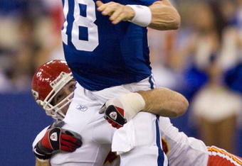 INDIANAPOLIS - NOVEMBER 18:  Peyton Manning #18 of the Indianapolis Colts looks to avoid being sacked by Jared Allen #69 of the Kansas City Chiefs on November 18, 2007 at the RCA Dome in Indianapolis, Indiana. The Colts defeated the Chiefs 13-10.  (Photo by Dilip Vishwanat/Getty Images)