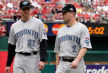 ST. LOUIS, MO - JULY 14:  American League All-Stars Roy Halladay and Aaron Hill of the Toronto Blue Jays look on before the 2009 MLB All-Star Game at Busch Stadium on July 14, 2009 in St Louis, Missouri. (Photo by Jamie Squire/Getty Images)