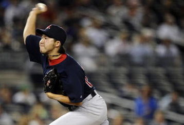 NEW YORK - AUGUST 07:  Junichi Tazawa #63 of the Boston Red Sox pitches against the New York Yankees in the 14th inning of the game on August 7, 2009 at Yankee Stadium in the Bronx borough of New York City.  (Photo by Jeff Zelevansky/Getty Images)