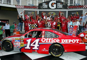 WATKINS GLEN, NY - AUGUST 10:  Tony Stewart (R), driver of the #14 Old Spice Chevrolet, celebrates in victory lane after winning the NASCAR Sprint Cup Series Heluva Good! Sour Cream Dips at Watkins Glen International on August 10, 2009 in Watkins Glen, New York.  (Photo by Todd Warshaw/Getty Images for NASCAR)