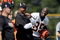GEORGETOWN, KY - JULY 31:  Chad Ochocinco #85 (R) of the Cincinnati Bengals and Head Coach Marvin Lewis (middle with white sleeves) share a lauugh during the Bengals training camp at Georgetown College on July 31, 2009 in Georgetown, Kentucky.  (Photo by Andy Lyons/Getty Images)