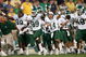 SOUTH BEND, IN - SEPTEMBER 17: Running back Javon Ringer #39 of the Michigan State Spartans leads the bench onto the field in celebration after defeating the Notre Dame Fighting Irish in overtime on September 17, 2005 at Notre Dame Stadium in South Bend, Indiana. Michigan State defeated Notre Dame 44-41 in OT. (Photo by Elsa/Getty Images)