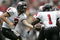 COLUMBUS, OH - SEPTEMBER 2:  Quaterback Phil Horvath #3 of the Northern Illinois University Huskies hands-off the ball to his running back Garrett Wolfe #1 during the game against the Ohio State University Buckeyes on September 2, 2006 at Ohio Stadium in Columbus, Ohio. OSU won 35-12.  (Photo By Gregory Shamus/Getty Images)  