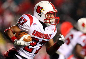 PISCATAWAY, NJ - DECEMBER 04:  Doug Beaumont #27 of the Louisville Cardinals runs with the ball against the Rutgers Scarlet Knights at Rutgers Stadium on December 4, 2008 in Piscataway, New Jersey.  (Photo by Jim McIsaac/Getty Images)