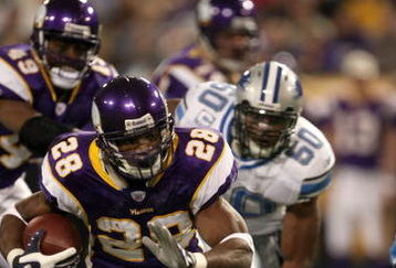MINNEAPOLIS - DECEMBER 2:  Running back Adrian Peterson #28 of the Minnesota Vikings carries the ball against the Detroit Lions defends at the Metrodome December 2, 2007 in Minneapolis, Minnesota. The Vikings won 42-10.  (Photo by Stephen Dunn/Getty Images)