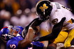 KANSAS CITY, MO - NOVEMBER 24:  Brandon McAnderson #35 of the Kansas Jayhawks is brought down by Sean Weatherspoon #12 of the Missouri Tigers during the game at Arrowhead Stadium November 24, 2007 in Kansas City, Missouri.  (Photo by Jamie Squire/Getty Images)