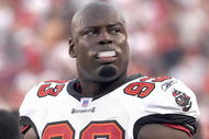 TAMPA, FL - AUGUST 10:  Defensive end Kevin Carter #93  of the Tampa Bay Buccaneers watches play from the sideline during a preseason game against the New England Patriots at Raymond James Stadium on August 10, 2007 in Tampa, Florida. The Bucs won 13 - 10. (Photo by Al Messerschmidt/Getty Images)
