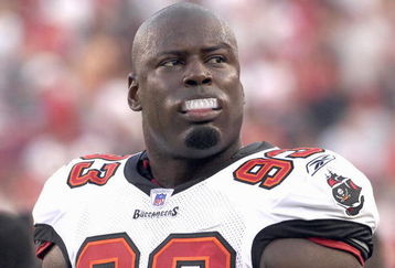 TAMPA, FL - AUGUST 10:  Defensive end Kevin Carter #93  of the Tampa Bay Buccaneers watches play from the sideline during a preseason game against the New England Patriots at Raymond James Stadium on August 10, 2007 in Tampa, Florida. The Bucs won 13 - 10. (Photo by Al Messerschmidt/Getty Images)