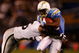 SAN DIEGO - DECEMBER 04:  Running Back Darren Sproles #43 is hit by Derrick Burgess #56 of the Oakland Raiders during their NFL Game on December 4, 2008 at Qualcomm Stadium in San Diego, California.  (Photo by Harry How/Getty Images)