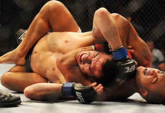 PHILADELPHIA - AUGUST 08:   Lightweight champion BJ Penn (R) battles Kenny Florian during their lightweight championship title bout at UFC 101: Declaration at the Wachovia Center on August 8, 2009 in Philadelphia, Pennsylvania.  (Photo by Jon Kopaloff/Getty Images)